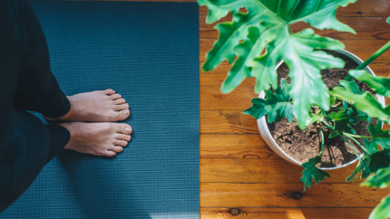 Blue yoga mat with feet on it for Down Dog free yoga streaming 