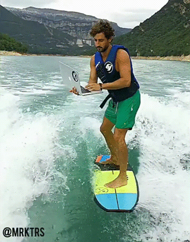 guy water skiing with laptop